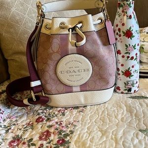 Brand new with tags, Dempsey Coach Bag. Never Used, Smoke Free and Pet Free Home